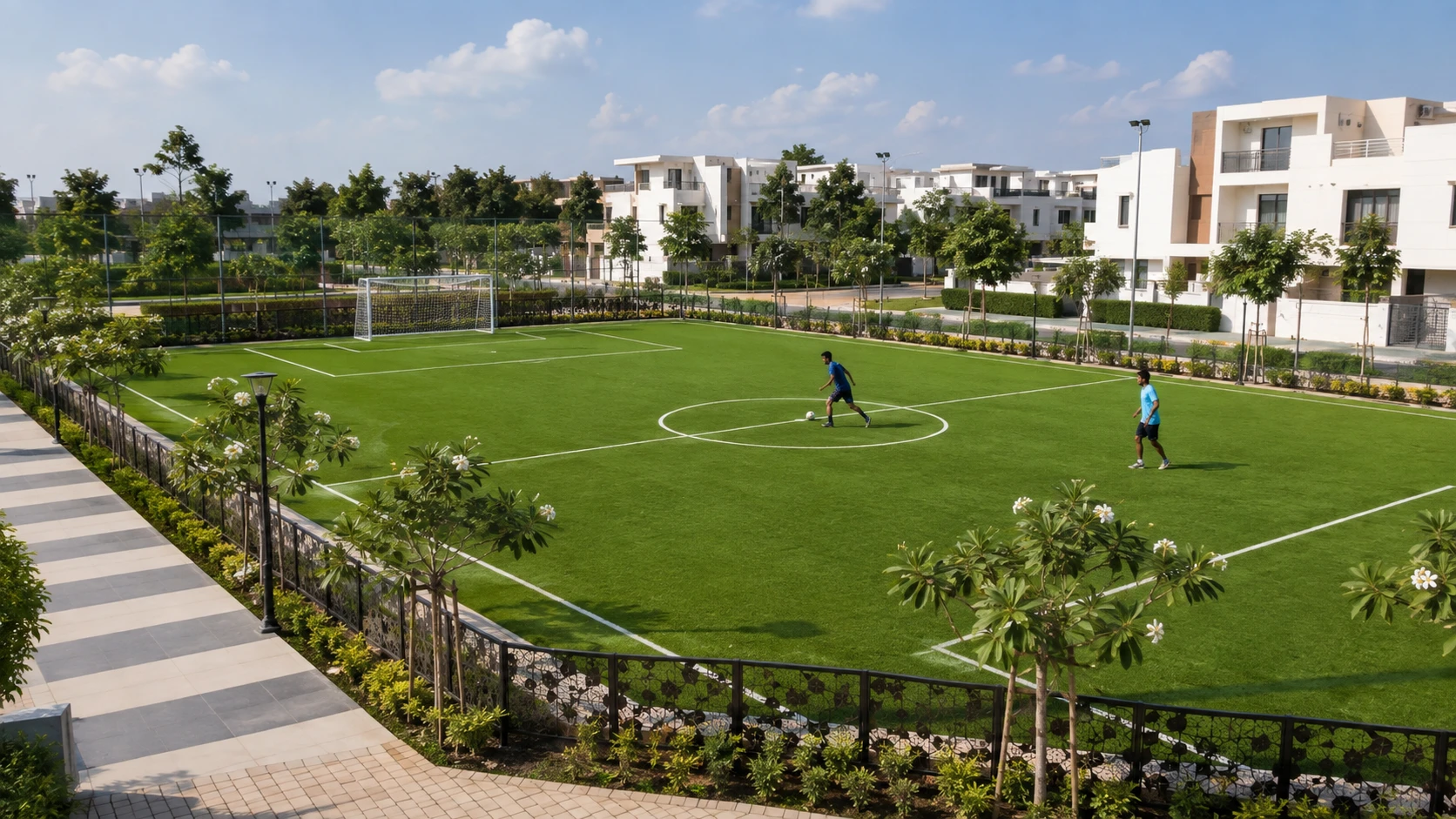 Green football ground with players